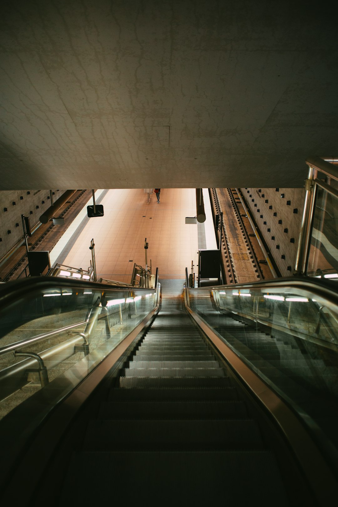 black and silver escalator inside building