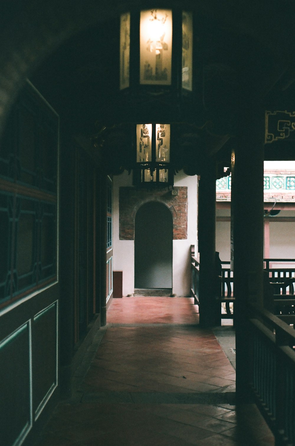 brown wooden floor and white concrete pillar