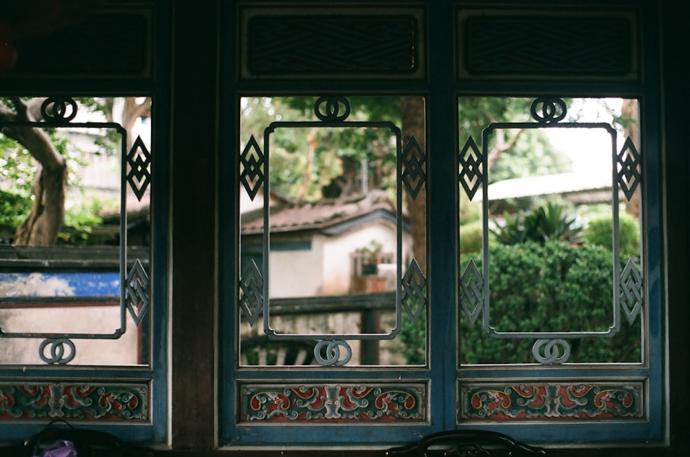 brown wooden framed glass window