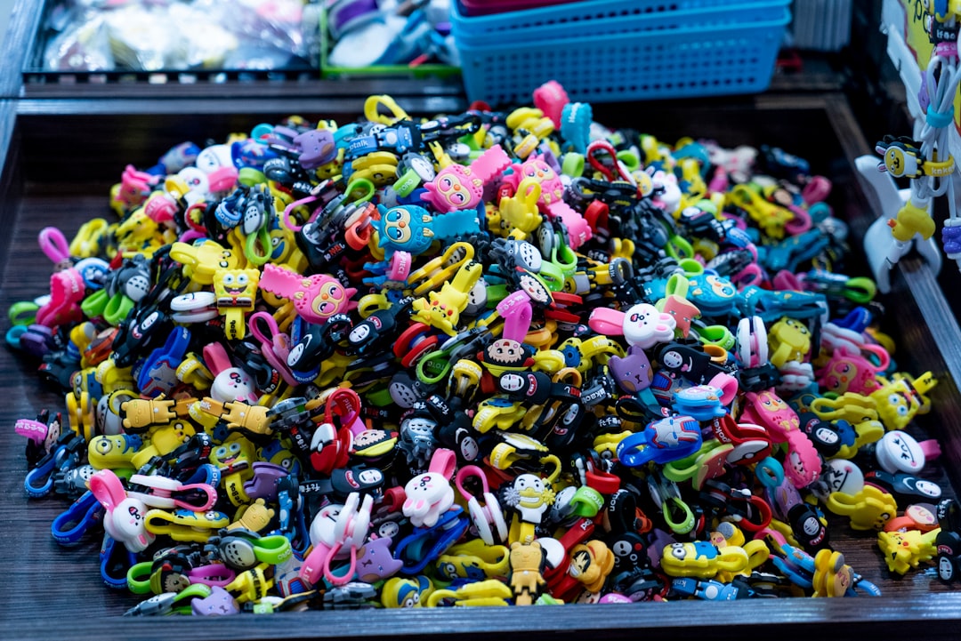 assorted plastic toys on blue plastic crate