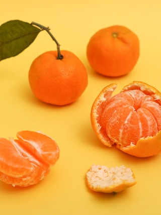 sliced orange fruit beside white cheese