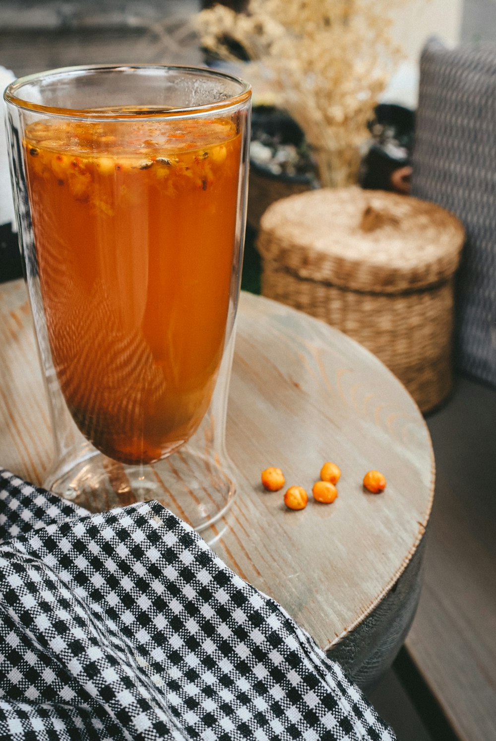 clear drinking glass with brown liquid