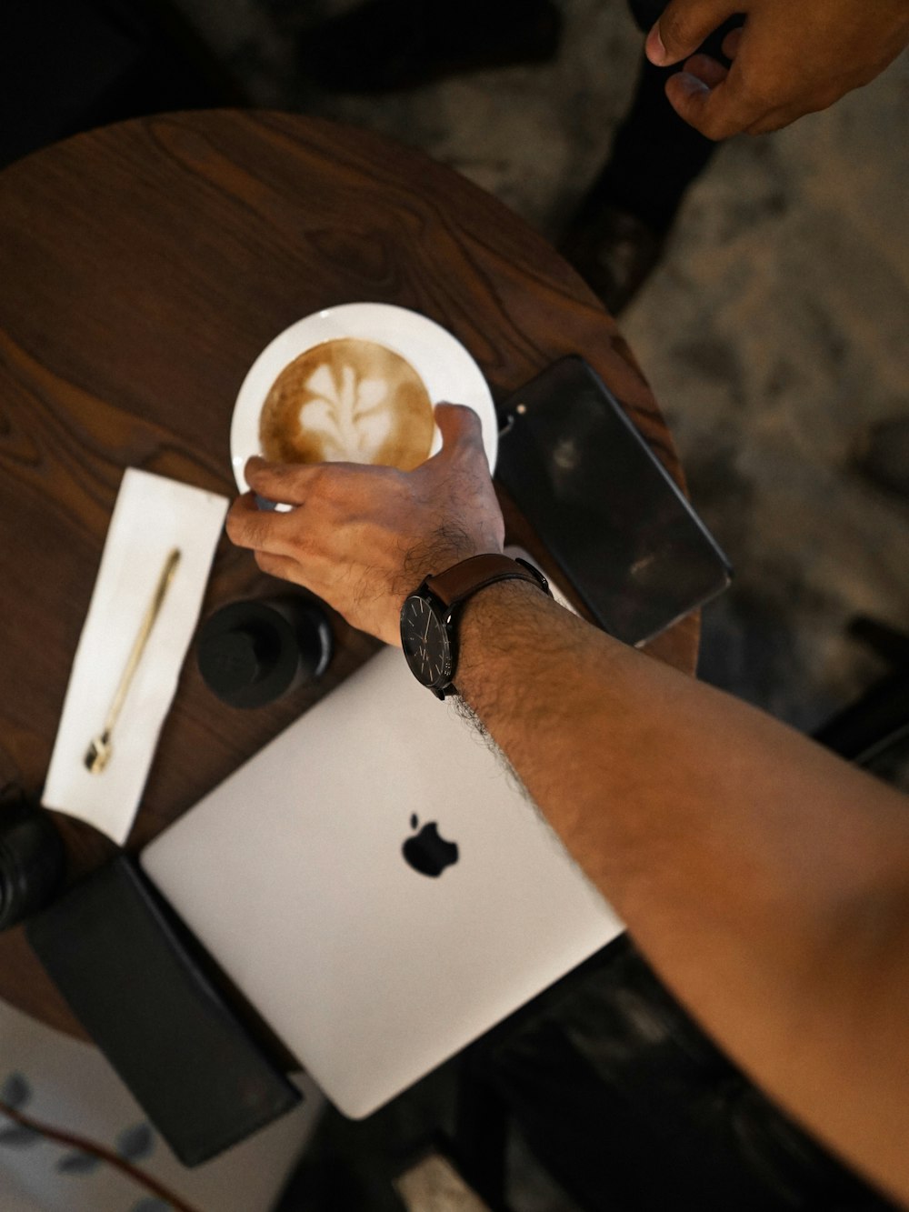 person holding white ceramic plate with bread