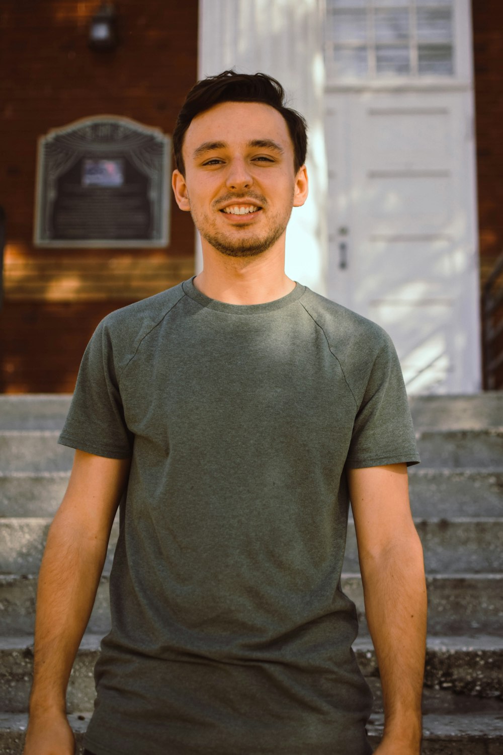 a man standing in front of a set of stairs