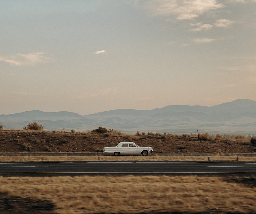 white car on road during daytime