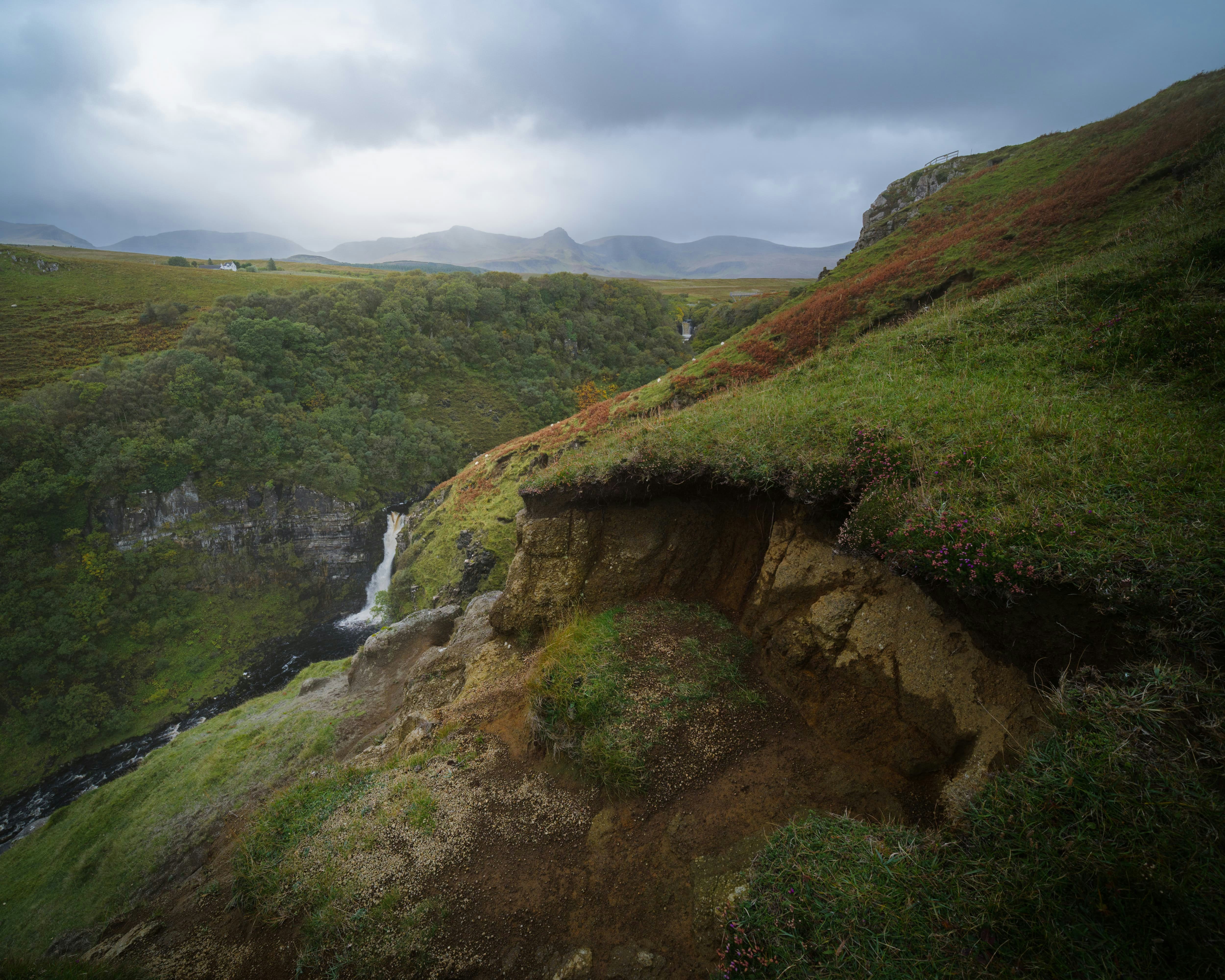 And now a much wider composition, which manages to capture both of the Lealt Falls with the Trotternish landslip and Sgùrr a’ Mhadaidh Ruaidh in the distance. A squall was also closing in on the peaks and started to obscure them.