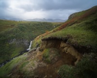 green and brown mountain under white clouds during daytime