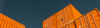 brown cardboard boxes under blue sky during daytime