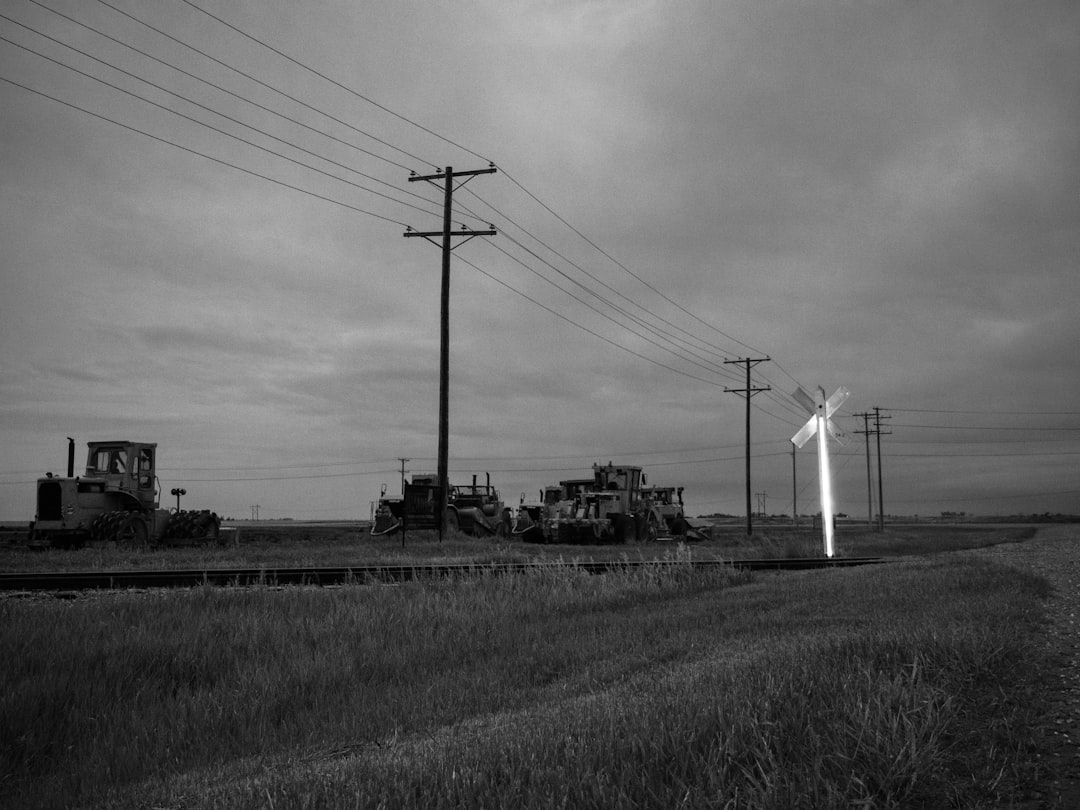grayscale photo of electric post