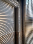 white window blinds on window