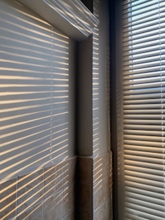 white window blinds on window
