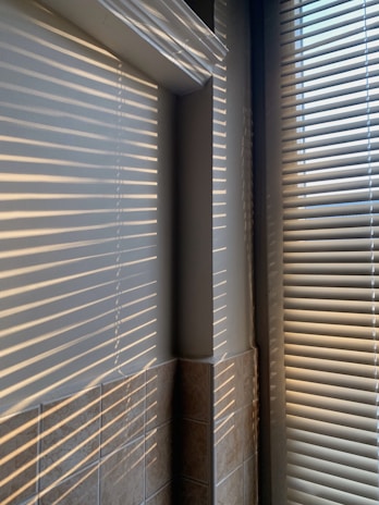 white window blinds on window