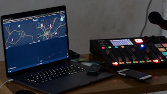 black laptop computer on brown wooden table