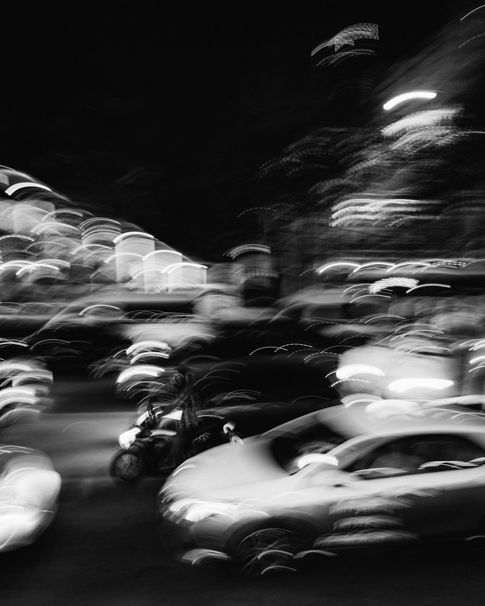 grayscale photo of cars on road