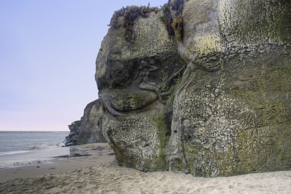 gray rock formation on beach during daytime