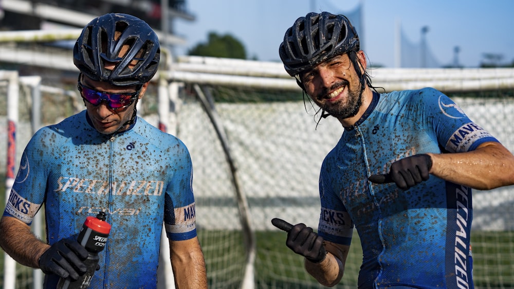 man in blue and black button up shirt wearing black helmet