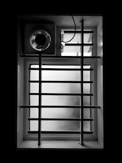 Before and after photos showing a bathroom ventilation upgrade.