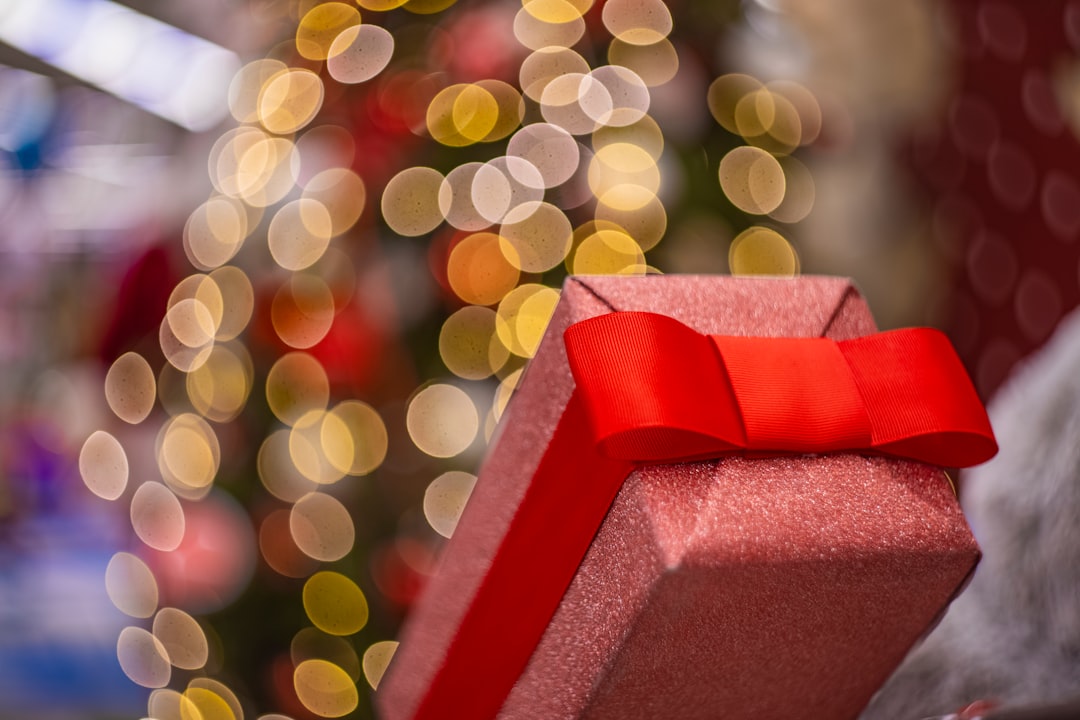 red gift box with yellow and green lights