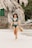 woman in blue bikini wearing brown sun hat
