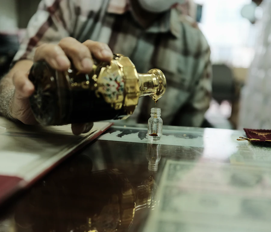 Oud oil being decanted