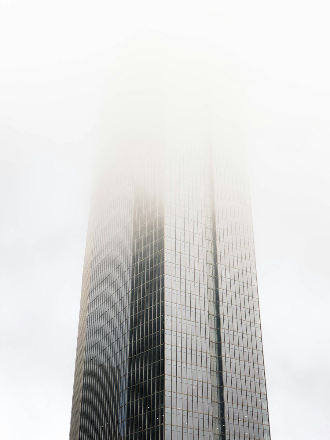 white concrete building under white sky during daytime