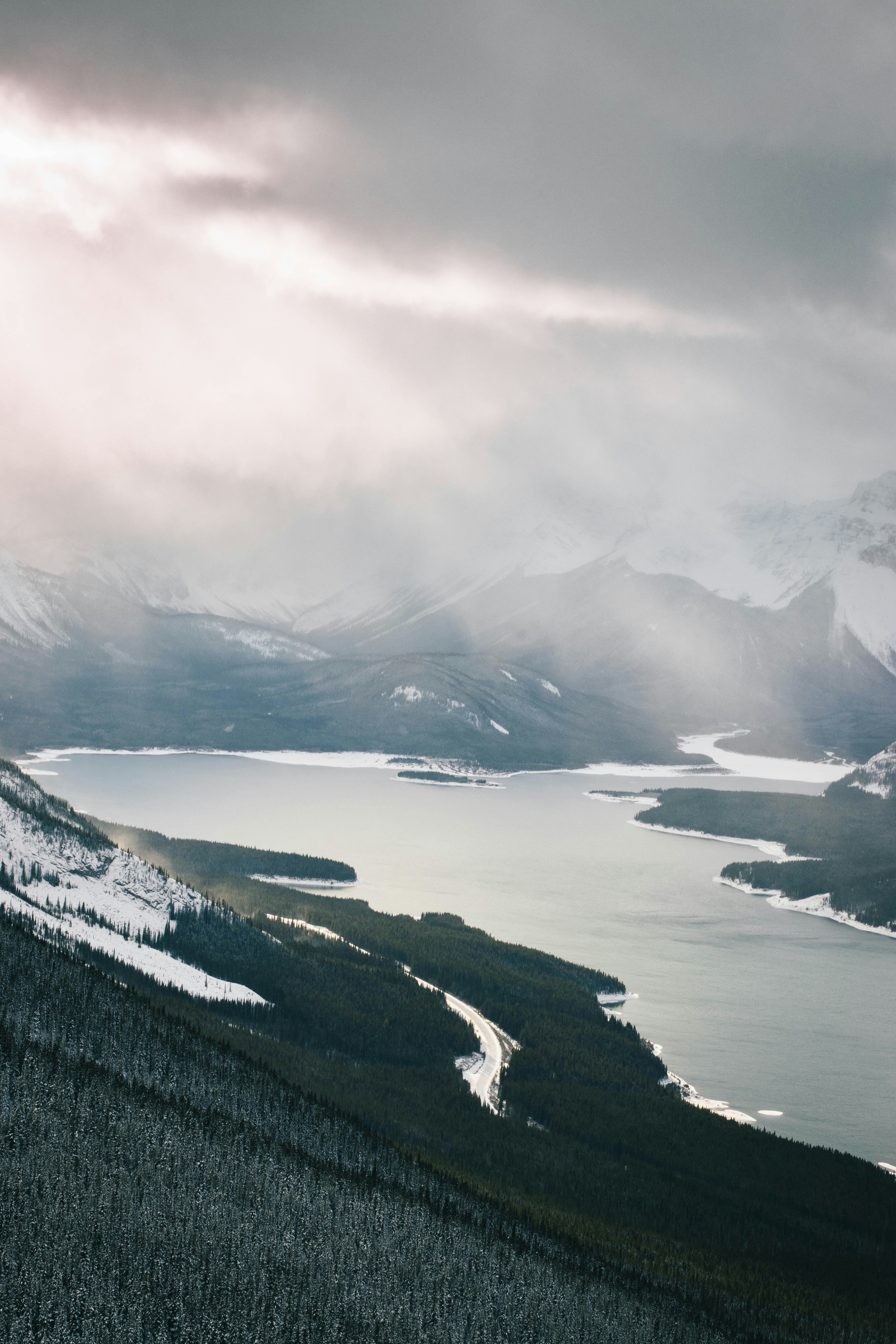 grayscale photo of lake and mountains