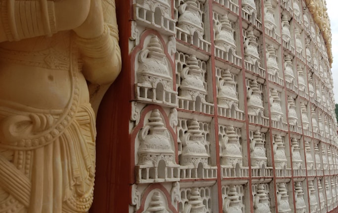 Close-up of a sleek Corian mandir with intricate CNC-carved details.
