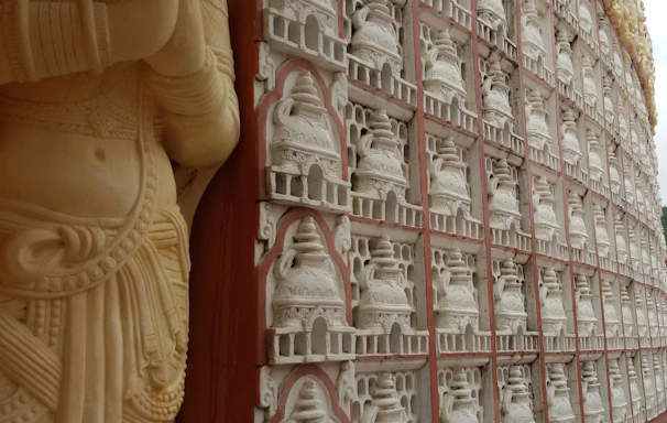 Close-up of a beautifully carved white marble temple with intricate details.