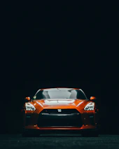 orange lamborghini aventador in dark room