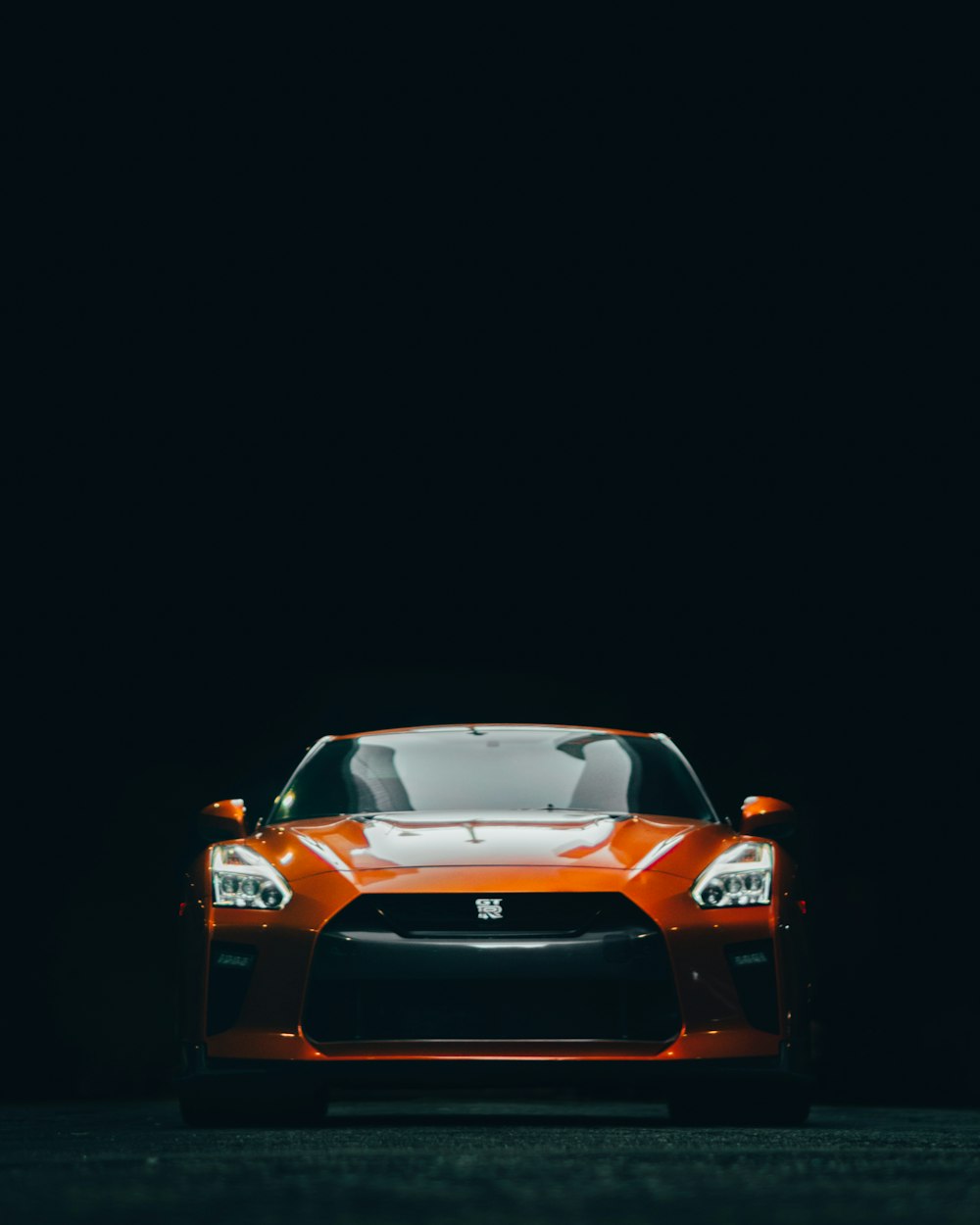 orange lamborghini aventador in dark room