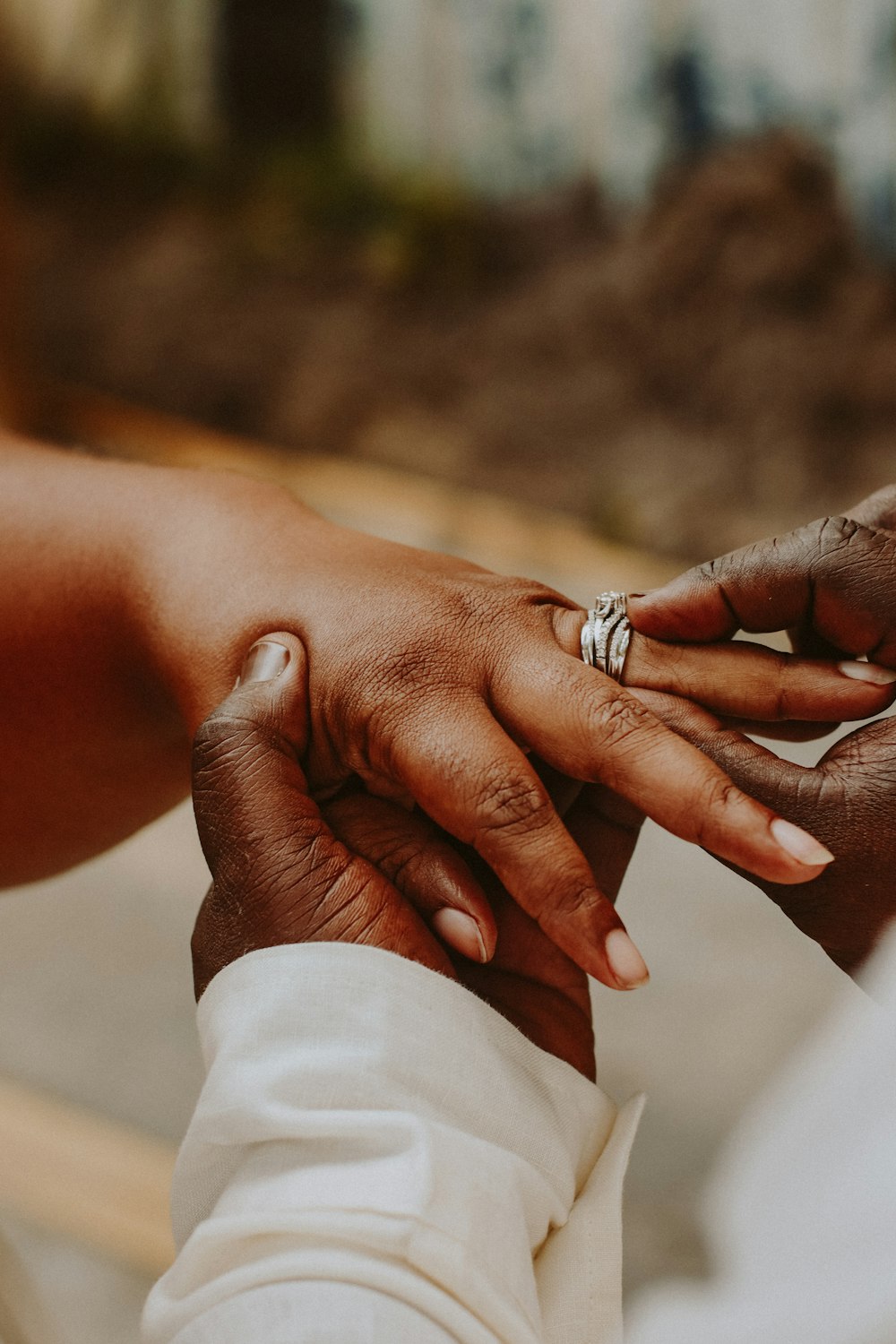 person wearing silver diamond ring