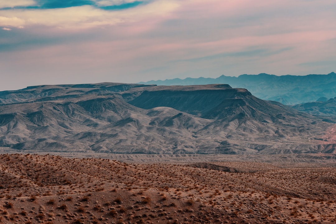 brown and gray mountains under white clouds during daytime