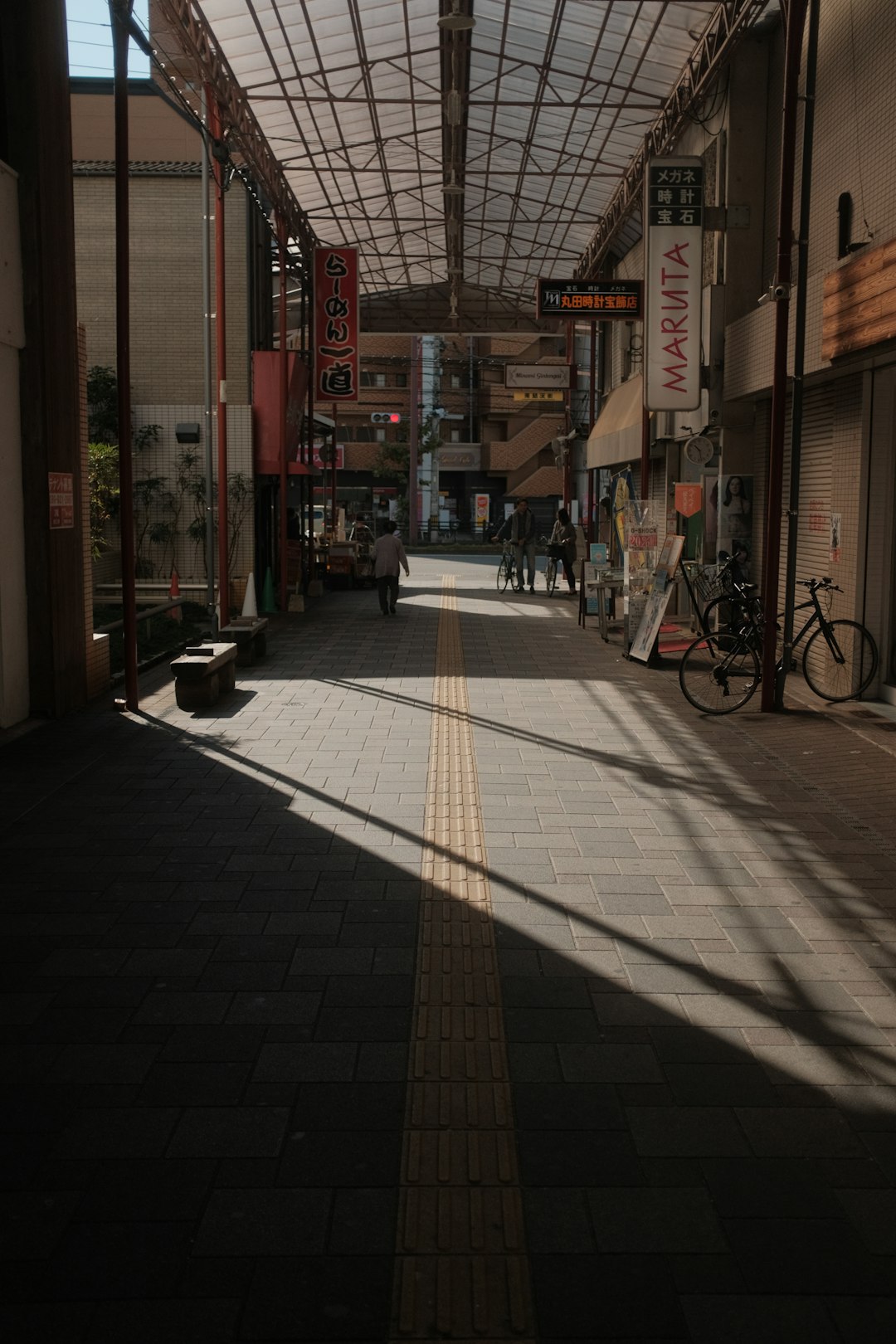 people walking on sidewalk during daytime