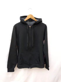 A sleek black hoodie displayed on a mannequin against a dark background, highlighting its modern design.