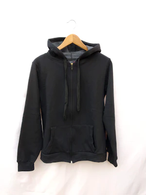 Close-up of a matte black hoodie with subtle metallic silver accents on a crisp white background