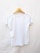 A plain white t-shirt is displayed on a wooden hanger against a light background. The t-shirt is short-sleeved and appears to be made of a lightweight material.