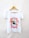 A white t-shirt hanging on a wooden hanger features a graphic design. The center showcases an eagle's head within a star shape, surrounded by flames and text that reads 'Rock and Roll' and 'Made in Heaven.'