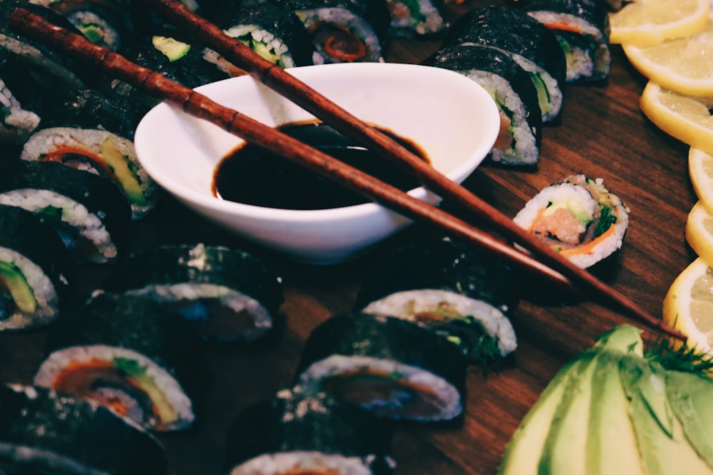 brown chopsticks on white ceramic bowl