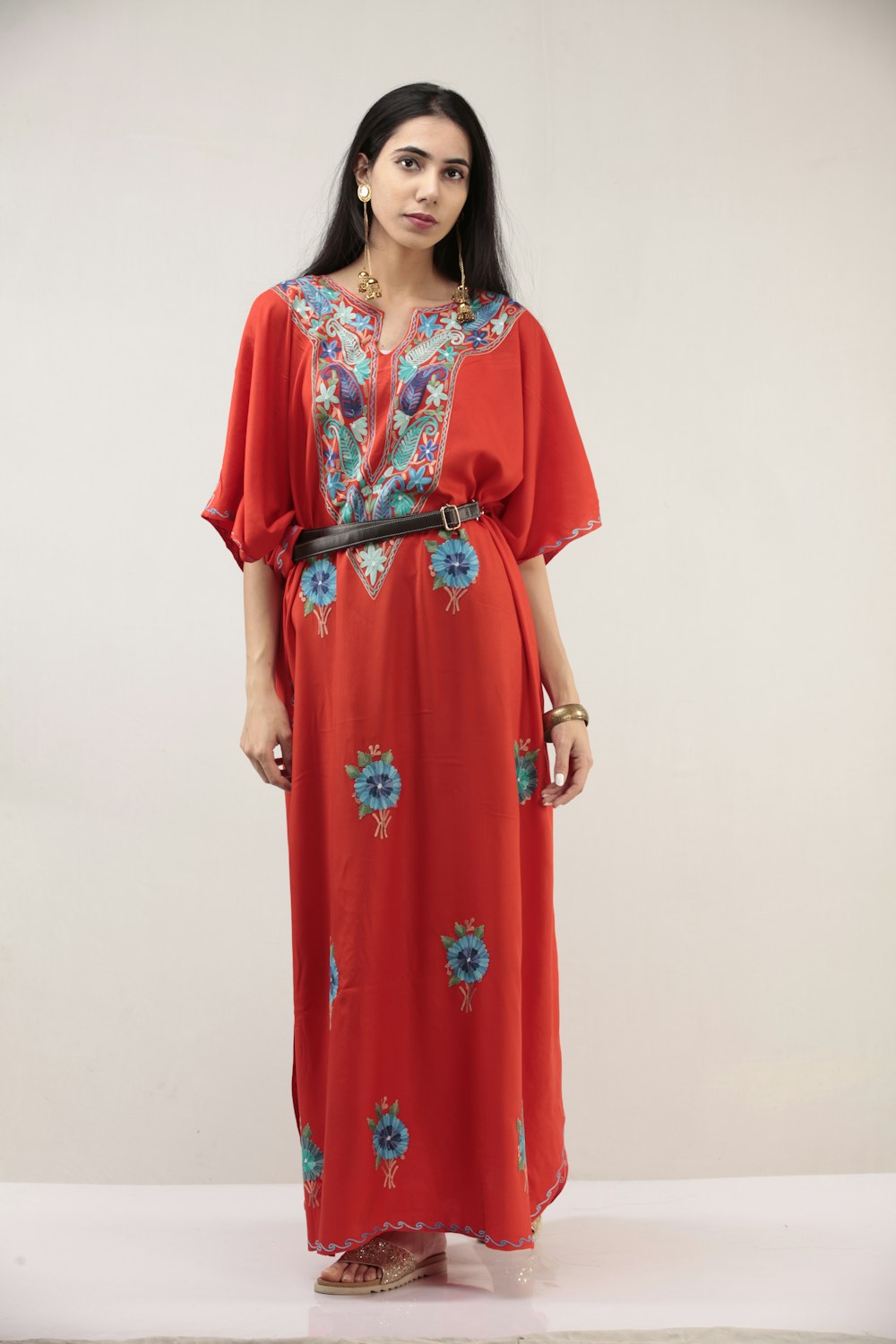 woman in red and white floral dress