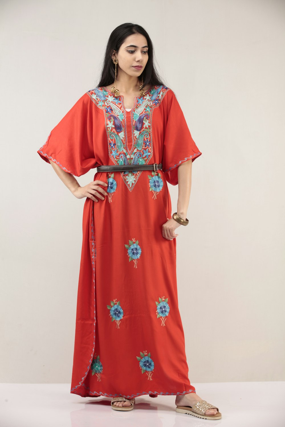 woman in red and white floral sari