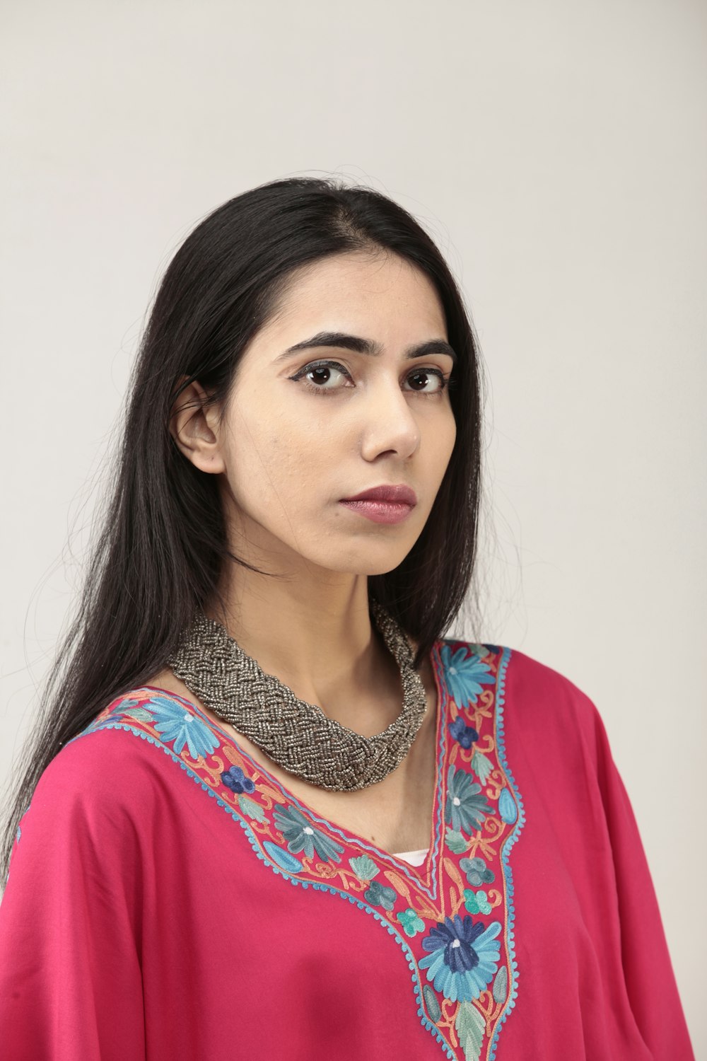 woman in red and white floral shirt