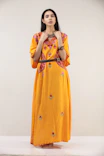 woman in yellow and white floral dress