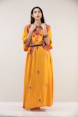 woman in yellow and white floral dress