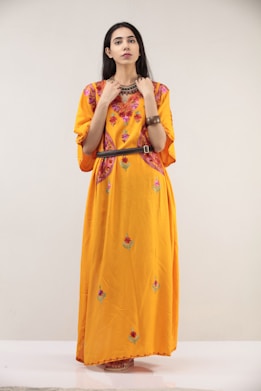 woman in yellow and white floral dress