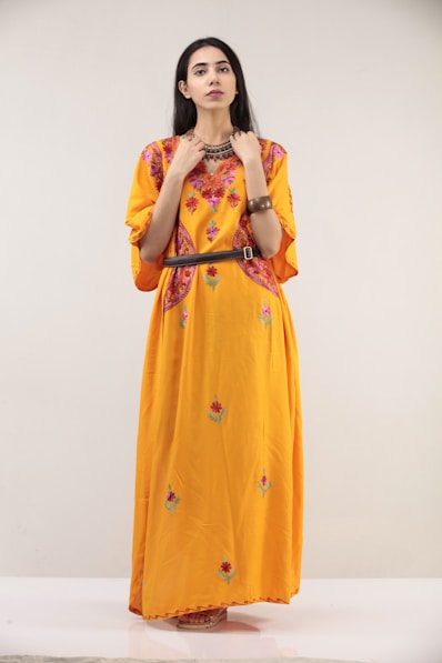 woman in yellow and white floral dress