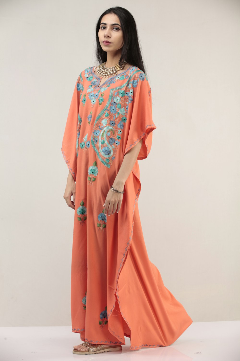 woman in orange and white sari