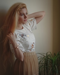 girl in white crew neck t-shirt and white skirt