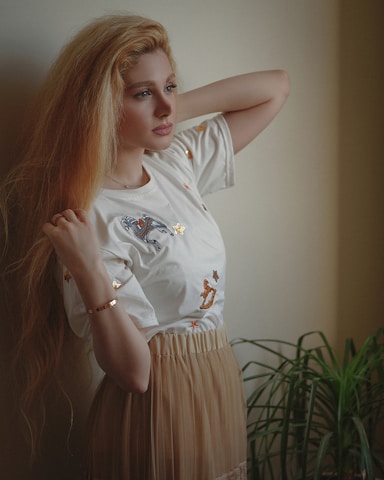 girl in white crew neck t-shirt and white skirt