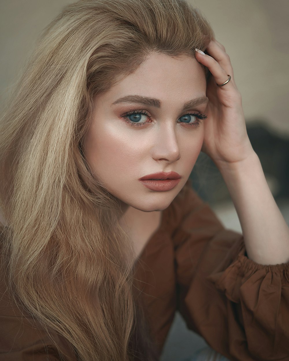 woman in brown long sleeve shirt