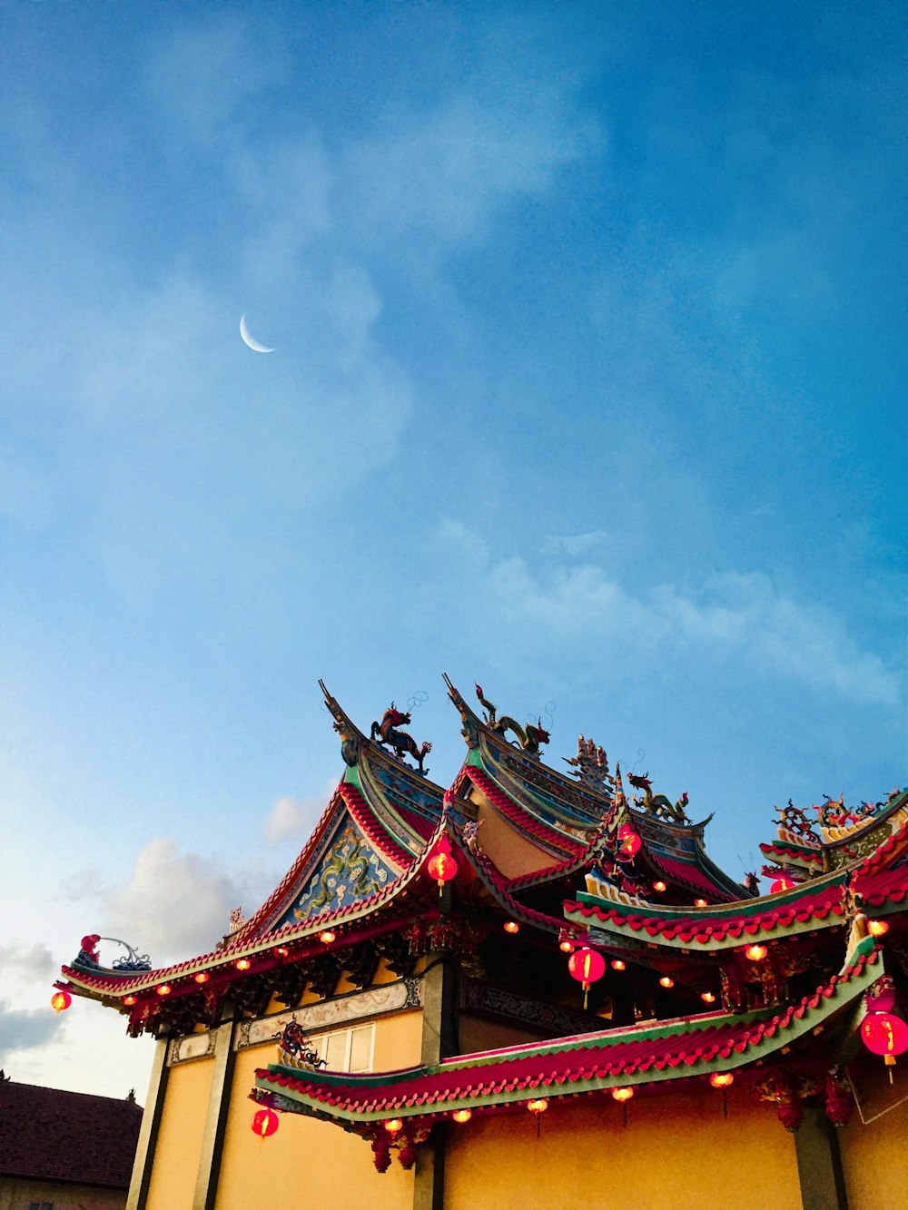 red and green temple under blue sky